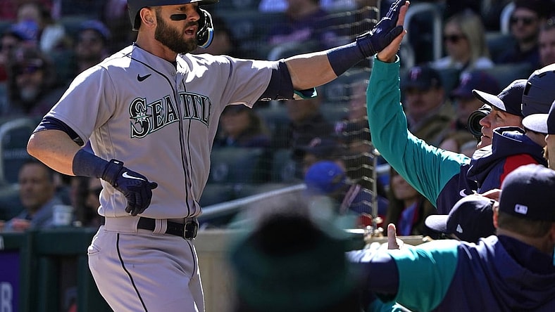 Apr 8, 2022; Minneapolis, Minnesota, USA;  Seattle Mariners right fielder Mitch Haniger (17) celebrates his two-run home run off of Minnesota Twins starting pitcher Joe Ryan (41) with his teammates during the first inning at Target Field. Mandatory Credit: Nick Wosika-USA TODAY Sports