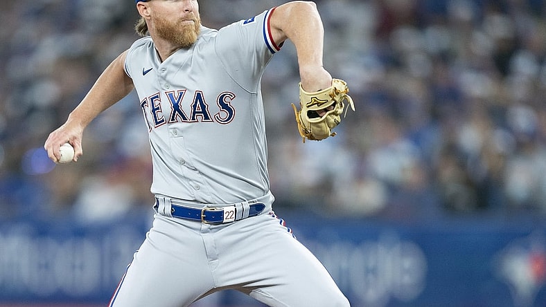 Apr 8, 2022; Toronto, Ontario, CAN; Texas Rangers starting pitcher Jon Gray (22) throws a pitch during the first inning against the Toronto Blue Jays at Rogers Centre . Mandatory Credit: Nick Turchiaro-USA TODAY Sports