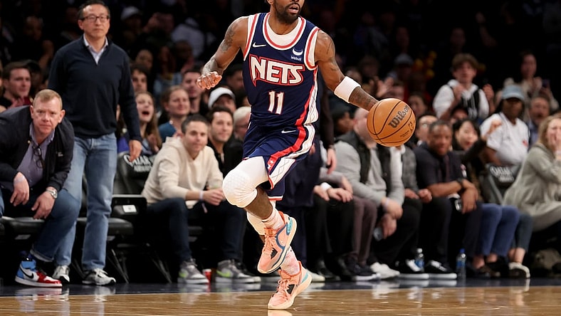Apr 8, 2022; Brooklyn, New York, USA; Brooklyn Nets guard Kyrie Irving (11) brings the ball up court against the Cleveland Cavaliers during the fourth quarter at Barclays Center. Mandatory Credit: Brad Penner-USA TODAY Sports