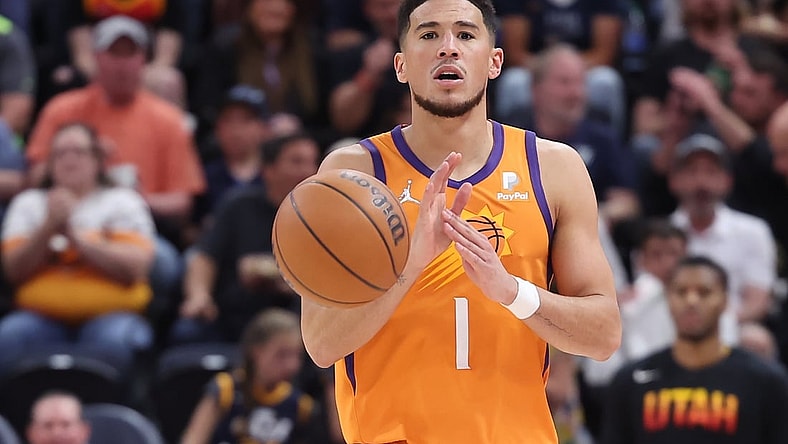 Apr 8, 2022; Salt Lake City, Utah, USA; Phoenix Suns guard Devin Booker (1) calls out a play while brings the ball up the court in the third quarter against the Utah Jazz at Vivint Arena. Mandatory Credit: Rob Gray-USA TODAY Sports