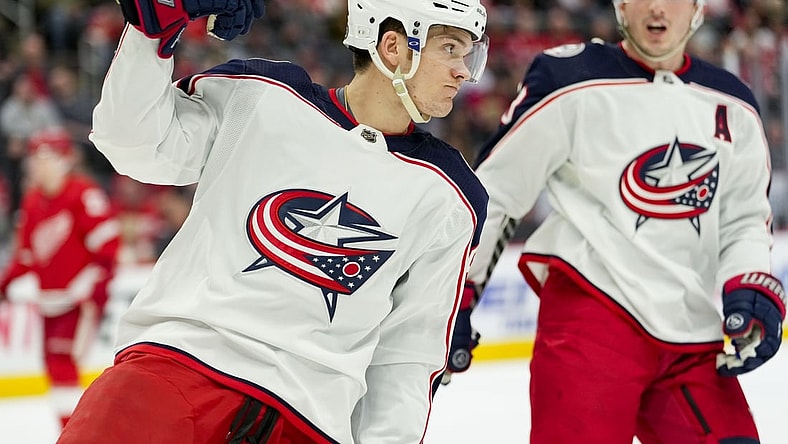 Apr 9, 2022; Detroit, Michigan, USA; Columbus Blue Jackets center Jack Roslovic (96) celebrates after scoring a goal during the first period against the Detroit Red Wings at Little Caesars Arena. Mandatory Credit: Raj Mehta-USA TODAY Sports