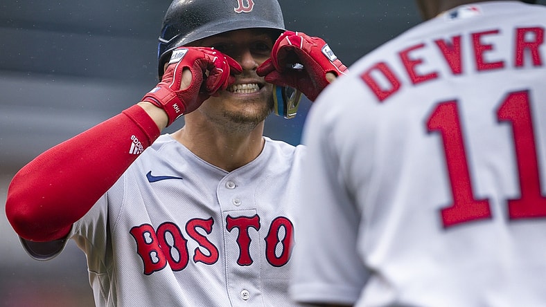 Apr 13, 2022; Detroit, Michigan, USA; Boston Red Sox center fielder Enrique Hernandez (5) celebrates with third baseman Rafael Devers (11) after hitting a solo home run during the third inning against the Detroit Tigers at Comerica Park. Mandatory Credit: Raj Mehta-USA TODAY Sports