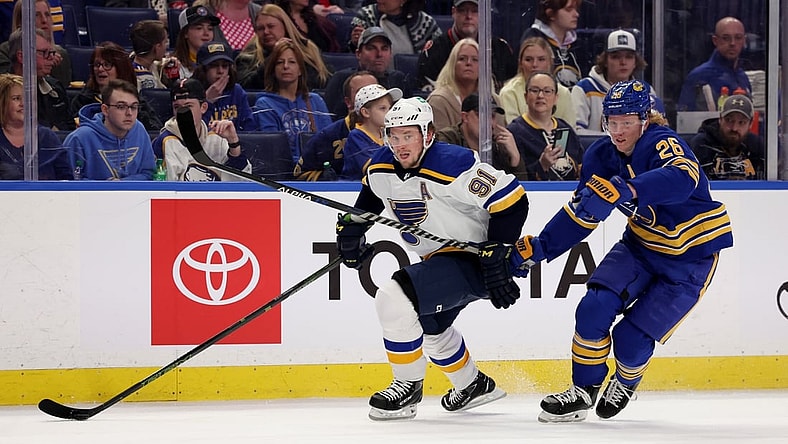 Apr 14, 2022; Buffalo, New York, USA;  St. Louis Blues right wing Vladimir Tarasenko (91) and Buffalo Sabres defenseman Rasmus Dahlin (26) looks for the puck during the first period at KeyBank Center. Mandatory Credit: Timothy T. Ludwig-USA TODAY Sports