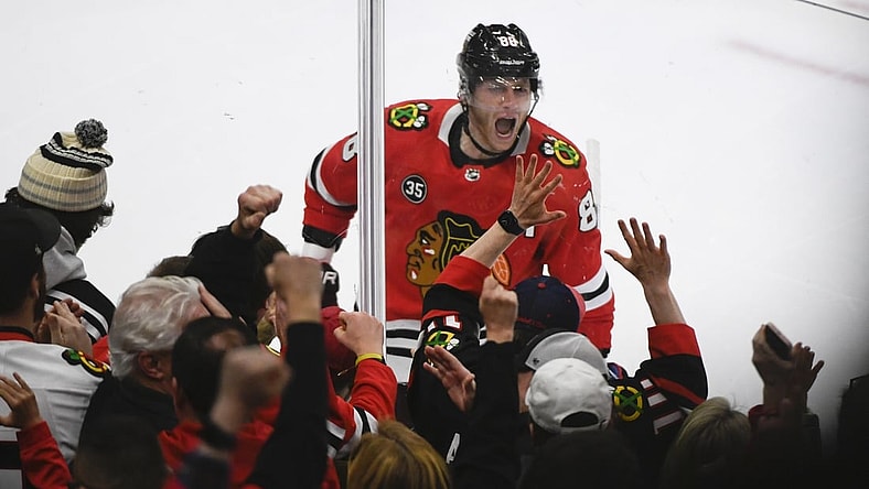 Apr 14, 2022; Chicago, Illinois, USA; Chicago Blackhawks right wing Patrick Kane (88) celebrates after he  scores a goal against San Jose Sharks goaltender James Reimer (47) during the first period at the United Center. Mandatory Credit: Matt Marton-USA TODAY Sports