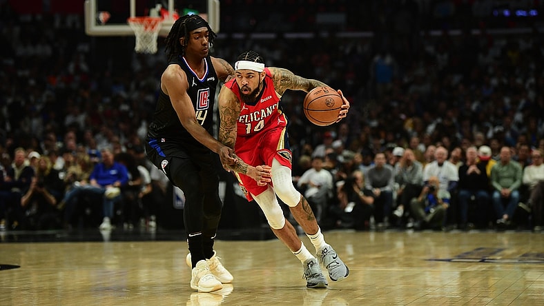 Apr 15, 2022; Los Angeles, California, USA; New Orleans Pelicans forward Brandon Ingram (14) moves the ball against Los Angeles Clippers guard Terance Mann (14) during the first half of the play in game at Crypto.com Arena. Mandatory Credit: Gary A. Vasquez-USA TODAY Sports