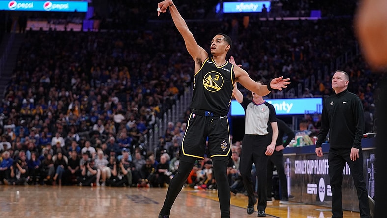 Apr 16, 2022; San Francisco, California, USA; Golden State Warriors guard Jordan Poole (3) follows through on a shot after making a three point basket against the Denver Nuggets in the fourth quarter during game one of the first round for the 2022 NBA playoffs at the Chase Center. Mandatory Credit: Cary Edmondson-USA TODAY Sports