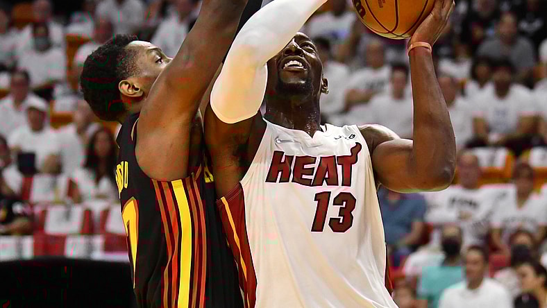 Apr 17, 2022; Miami, Florida, USA; Miami Heat center Bam Adebayo (13) goes up for a shot against Atlanta Hawks forward Onyeka Okongwu (17) during the first half of game one of the first round for the 2022 NBA playoffs at FTX Arena. Mandatory Credit: Jim Rassol-USA TODAY Sports