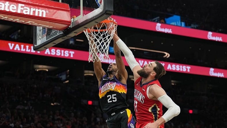 Apr 17, 2022; Phoenix, Arizona, USA; New Orleans Pelicans center Jonas Valanciunas (17) fouls Phoenix Suns forward Mikal Bridges (25) during the second half of game one of the first round for the 2022 NBA playoffs at Footprint Center. Mandatory Credit: Joe Camporeale-USA TODAY Sports