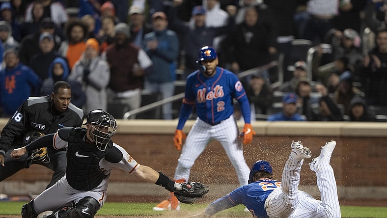 Apr 19, 2022; New York City, New York, USA; New York Mets first baseman Pete Alonzo (20) slides into home plate safely with San Francisco Giants catcher Curt Casali (2) missing the tag during the third inning at Citi Field. Mandatory Credit: Gregory Fisher-USA TODAY Sports