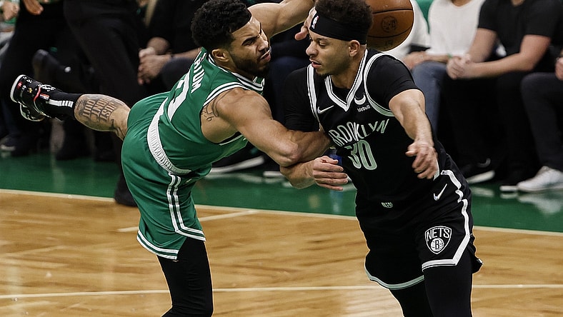 Apr 20, 2022; Boston, Massachusetts, USA; Brooklyn Nets guard Seth Curry (30) commits a flagrant foul on Boston Celtics forward Jayson Tatum (0) during the first quarter of game two of the first round for the 2022 NBA playoffs at TD Garden. Mandatory Credit: Winslow Townson-USA TODAY Sports