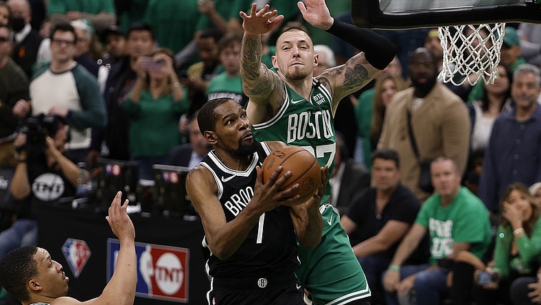 Apr 20, 2022; Boston, Massachusetts, USA; Brooklyn Nets forward Kevin Durant (7) tries to get to the basket past Boston Celtics center Daniel Theis (27) during the fourth quarter of game two of the first round of the 2022 NBA playoffs at TD Garden. Mandatory Credit: Winslow Townson-USA TODAY Sports