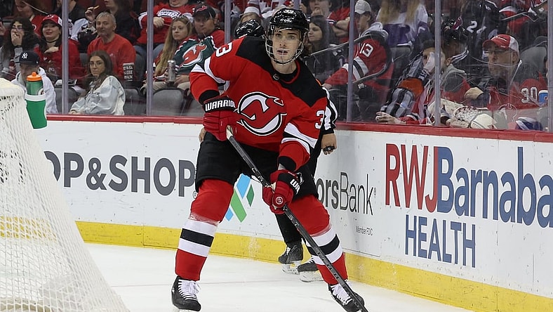 Apr 23, 2022; Newark, New Jersey, USA; New Jersey Devils defenseman Ryan Graves (33) controls the puck against the Carolina Hurricanes during the first period at Prudential Center. Mandatory Credit: Vincent Carchietta-USA TODAY Sports