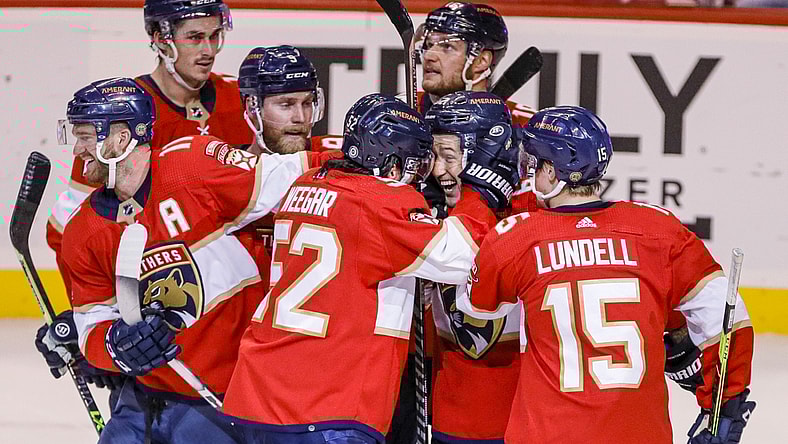 Apr 23, 2022; Sunrise, Florida, USA; Florida Panthers defenseman Brandon Montour, center, celebrates with defenseman MacKenzie Weegar (52) after scoring the winning goal during overtime against the Toronto Maple Leafs at FLA Live Arena. Mandatory Credit: Sam Navarro-USA TODAY Sports