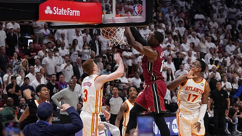 Apr 26, 2022; Miami, Florida, USA; Miami Heat center Bam Adebayo (13) dunks the ball over Atlanta Hawks guard Kevin Huerter (3) during the second half in game five of the first round for the 2022 NBA playoffs at FTX Arena. Mandatory Credit: Jasen Vinlove-USA TODAY Sports