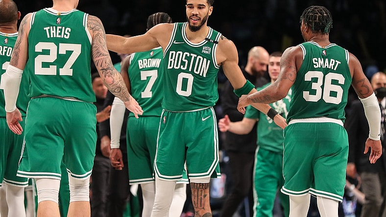 Apr 23, 2022; Brooklyn, New York, USA;  Boston Celtics forward Jayson Tatum (0) with center Daniel Theis (27) and guard Marcus Smart (36) at Barclays Center. Mandatory Credit: Wendell Cruz-USA TODAY Sports