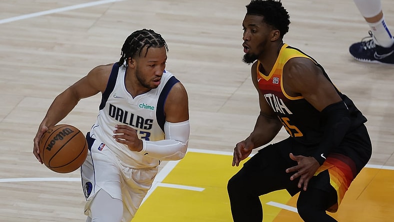 Apr 28, 2022; Salt Lake City, Utah, USA; Dallas Mavericks guard Jalen Brunson (13) drives the ball against Utah Jazz guard Donovan Mitchell (45) in the first quarter during game six of the first round for the 2022 NBA playoffs at Vivint Arena. Mandatory Credit: Rob Gray-USA TODAY Sports