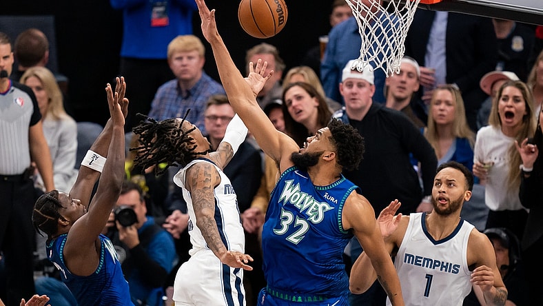 Apr 29, 2022; Minneapolis, Minnesota, USA; Memphis Grizzlies guard Ja Morant (12) shoots against the Minnesota Timberwolves center Karl-Anthony Towns (32) in the second quarter during game six of the first round for the 2022 NBA playoffs at Target Center. Mandatory Credit: Brad Rempel-USA TODAY Sports