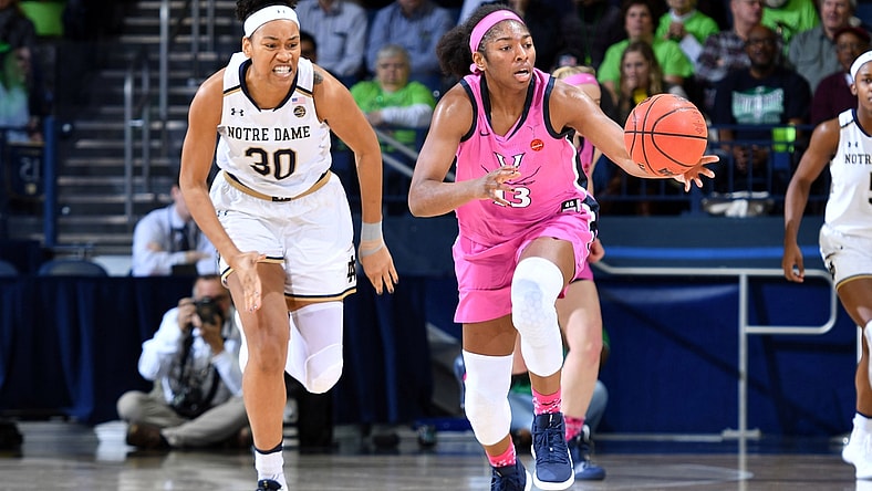 Mar 3, 2019; South Bend, IN, USA; Virginia Cavaliers guard Jocelyn Willoughby (13) grabs a loose ball as Notre Dame Fighting Irish center Mikayla Vaughn (30) pursues in the first half at the Purcell Pavilion. Mandatory Credit: Matt Cashore-USA TODAY Sports