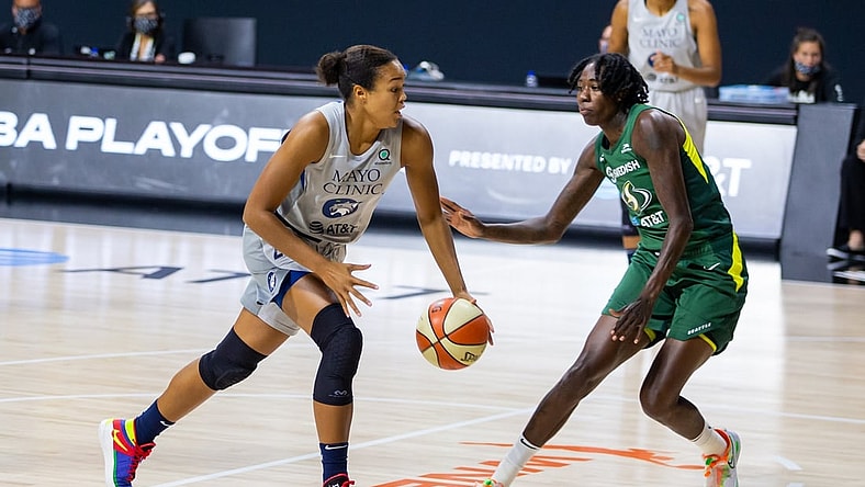Sep 24, 2020; Bradenton, Florida, USA; Minnesota Lynx forward Napheesa Collier (24) drives past Seattle Storm forward Natasha Howard (6) during Game 2 of the WNBA Semifinals at Feld Entertainment. Mandatory Credit: Mary Holt-USA TODAY Sports