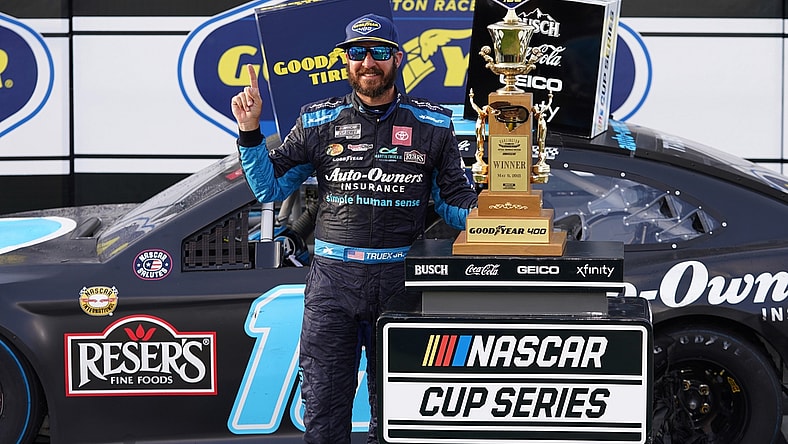 May 9, 2021; Darlington, South Carolina, USA; NASCAR Cup Series driver Martin Truex Jr. celebrates after winning the Goodyear 400 at Darlington Raceway. Mandatory Credit: Jasen Vinlove-USA TODAY Sports