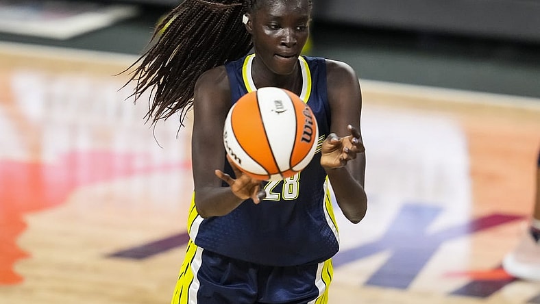 May 27, 2021; College Park, Georgia, USA; Dallas Wings center Awak Kuier (28) passes the ball against the Atlanta Dream during the first half at Gateway Center Arena at College Park. Mandatory Credit: Dale Zanine-USA TODAY Sports