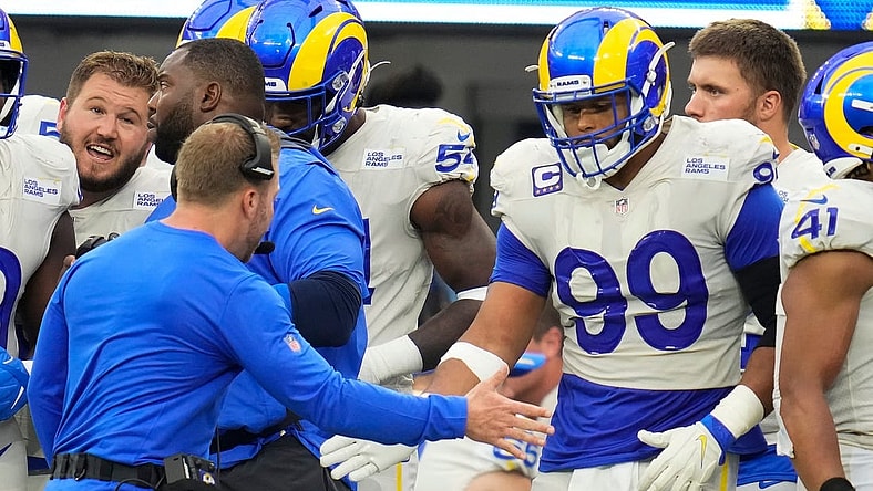Sep 26, 2021; Inglewood, California, USA; Los Angeles Rams head coach Sean McVay celebrates with defensive end Aaron Donald (99) as time runs out in the Rams win over the Tampa Bay Buccaneers at SoFi Stadium. Mandatory Credit: Robert Hanashiro-USA TODAY Sports