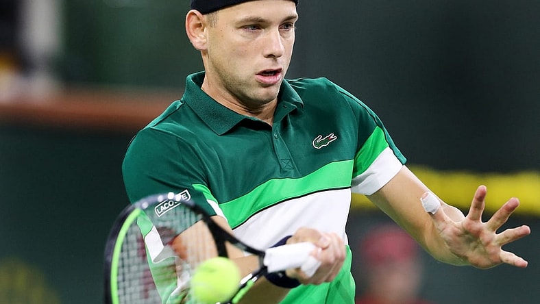 Filip Krajinovic of Serbia returns a shot to Daniil Medvedev of Russia on Stadium One during the BNP Paribas Open in Indian Wells, Calif., on October 11, 2021.

Daniil Medvedev Vs Filip Krajinovic Bnp Paribas2104
