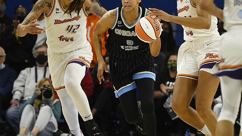 Oct 17, 2021; Chicago, Illinois, USA; Chicago Sky guard/forward Kahleah Copper (2) drives with the ball against Phoenix Mercury center Brittney Griner (42) and Phoenix Mercury forward Brianna Turner (21), right, during the second half of game four of the 2021 WNBA Finals at Wintrust Arena. Mandatory Credit: Matt Marton-USA TODAY Sports