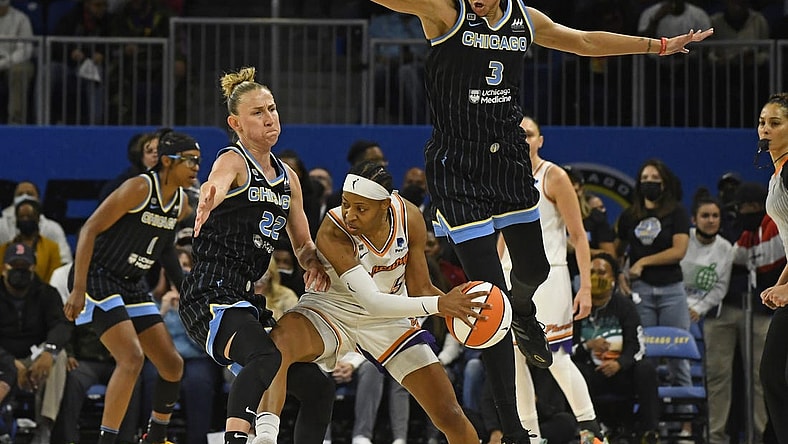 Oct 17, 2021; Chicago, Illinois, USA; Chicago Sky guard Courtney Vandersloot (22) and Chicago Sky forward/center Candace Parker (3) block Phoenix Mercury guard Shey Peddy (5) during the second half of game four of the 2021 WNBA Finals at Wintrust Arena. Mandatory Credit: Matt Marton-USA TODAY Sports