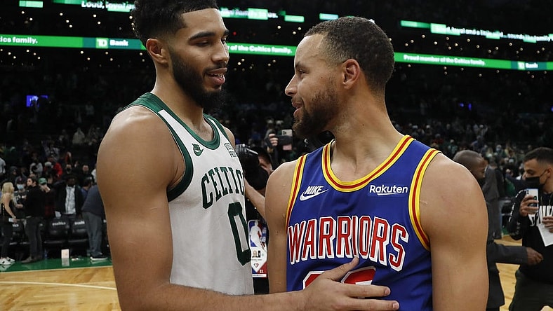 Dec 17, 2021; Boston, Massachusetts, USA; Boston Celtics forward Jayson Tatum (0) talks with Golden State Warriors guard Stephen Curry (30) after their game at TD Garden. Mandatory Credit: Winslow Townson-USA TODAY Sports
