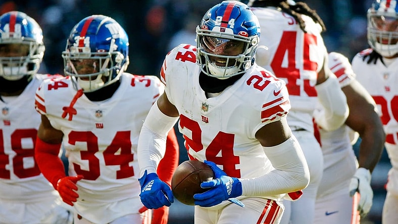Jan 2, 2022; Chicago, Illinois, USA; New York Giants cornerback James Bradberry (24) reacts after intercepting a pass against the Chicago Bears during the second half at Soldier Field. Mandatory Credit: Jon Durr-USA TODAY Sports