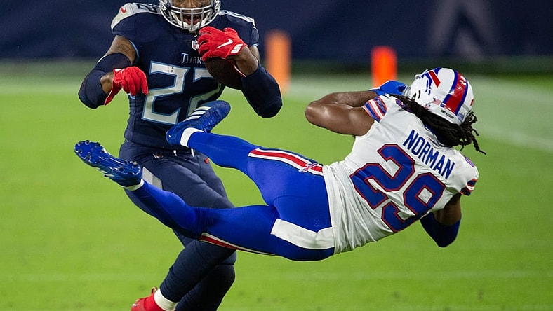 Tennessee Titans running back Derrick Henry (22) throws Buffalo Bills cornerback Josh Norman (29) aside as he rushes up the field during the second quarter at Nissan Stadium Tuesday, Oct. 13, 2020 in Nashville, Tenn.

Nas Titans Bills 001