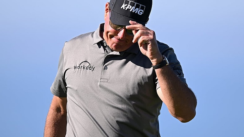 Jan 27, 2022; San Diego, California, USA; Phil Mickelson acknowledges the crowd after a putt on the fourth green during the first round of the Farmers Insurance Open golf tournament at Torrey Pines Municipal Golf Course - South Course. Mandatory Credit: Orlando Ramirez-USA TODAY Sports