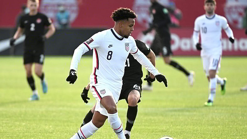 Jan 30, 2022; Hamilton, Ontario, CAN;  United States forward Weston McKennie (8) plays a pass against Canada during a CONCACAF FIFA World Cup Qualifier soccer match at Tim Hortons Field. Mandatory Credit: Dan Hamilton-USA TODAY Sports