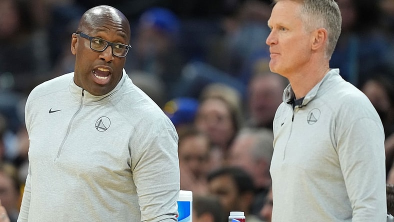 Mar 8, 2022; San Francisco, California, USA; Golden State Warriors assistant coach Mike Brown talks to head coach Steve Kerr during the third quarter against the LA Clippers at Chase Center. Mandatory Credit: Darren Yamashita-USA TODAY Sports
