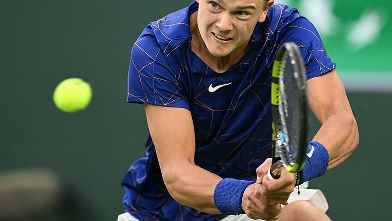 Mar 13, 2022; Indian Wells, CA, USA; Holger Rune (DEN) hits a shot against Matteo Berrettini (ITA) during his third round match at the BNP Paribas Open at the Indian Wells Tennis Garden. Mandatory Credit: Jayne Kamin-Oncea-USA TODAY Sports