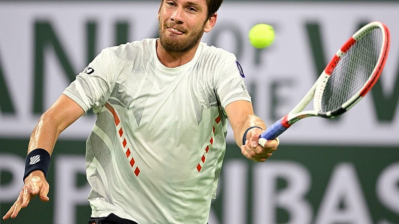 Mar 17, 2022; Indian Wells, CA, USA;  Cameron Norrie (GBR) hits a shot in his quarterfinal match against Carlos Alcaraz (ESP) at the BNP Paribas Open at the Indian Wells Tennis Garden. Mandatory Credit: Jayne Kamin-Oncea-USA TODAY Sports