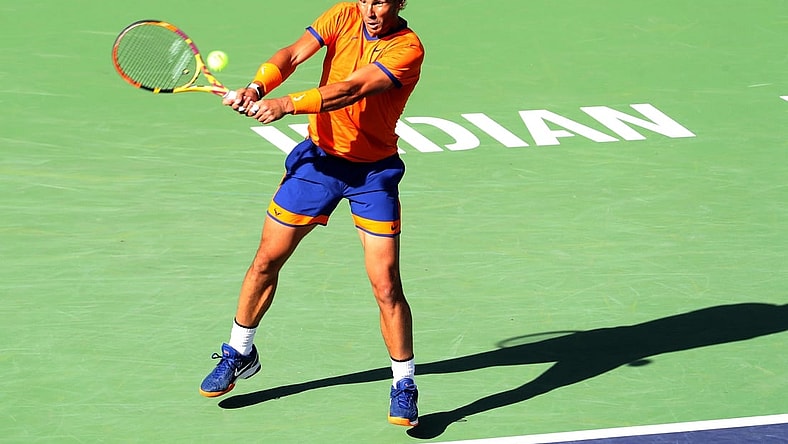Rafael Nadal of Spain hits a return to American Taylor Fritz to during the men's final at the BNP Paribas Open in Indian Wells, Calif., on Sunday, March 2022.

Bnp Paribas Open Taylor Fritz Vs Rafael Nadal560