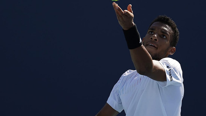 Mar 26, 2022; Miami Gardens, FL, USA; Felix Auger-Aliassime (CAN) serves against Miomir Kecmanovic (SRB)(not pictured) in a second round mens's singles match in the Miami Open at Hard Rock Stadium. Mandatory Credit: Geoff Burke-USA TODAY Sports