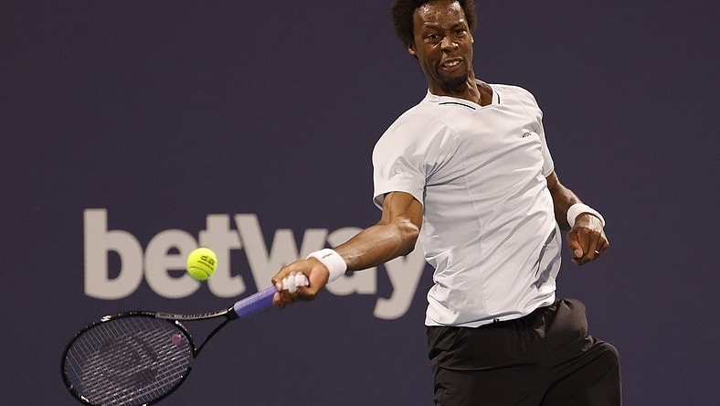 Mar 27, 2022; Miami Gardens, FL, USA; Gael Monfils (FRA) hits a forehand against Francisco Cerundolo (ARG)(not pictured) in a third round men's singles match in the Miami Open at Hard Rock Stadium. Mandatory Credit: Geoff Burke-USA TODAY Sports