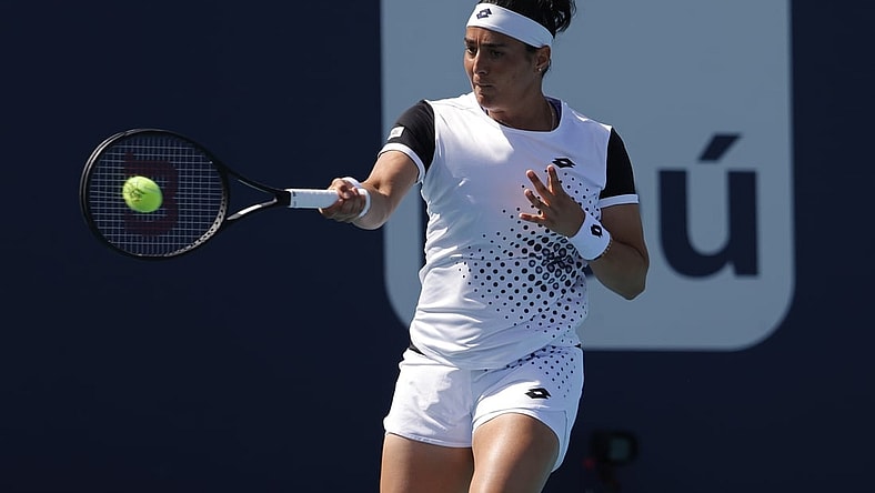 Mar 28, 2022; Miami Gardens, FL, USA; Ons Jabeur (TUN) hits a forehand against Danielle Collins (USA)(not pictured) in a fourth round women's singles match in the Miami Open at Hard Rock Stadium. Mandatory Credit: Geoff Burke-USA TODAY Sports