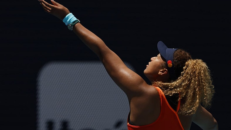 Apr 2, 2022; Miami Gardens, FL, USA; Naomi Osaka (JPN) hits a backhand against Iga Swiatek (POL)(not pictured) in the women's singles final in the Miami Open at Hard Rock Stadium. Mandatory Credit: Geoff Burke-USA TODAY Sports