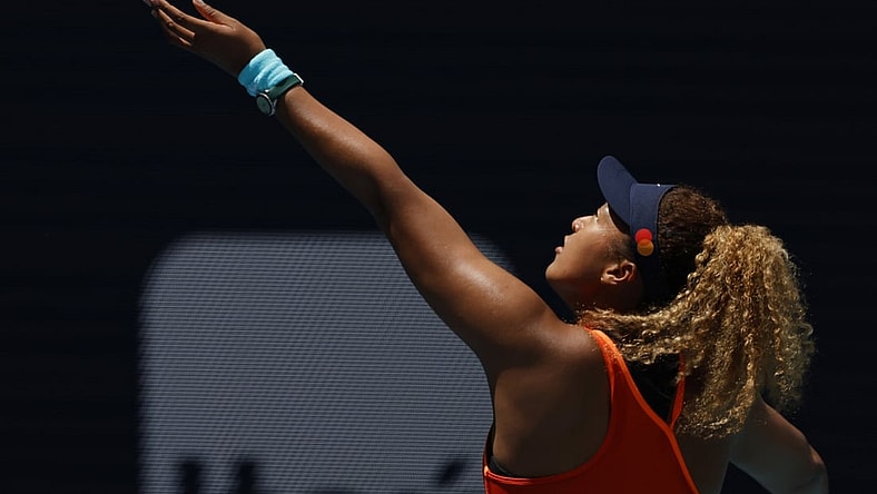 Apr 2, 2022; Miami Gardens, FL, USA; Naomi Osaka (JPN) hits a backhand against Iga Swiatek (POL)(not pictured) in the women's singles final in the Miami Open at Hard Rock Stadium. Mandatory Credit: Geoff Burke-USA TODAY Sports