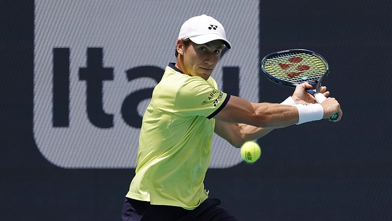 Apr 3, 2022; Miami Gardens, FL, USA; Casper Ruud (NOR) hits a backhand against Carlos Alcaraz (ESP)(not pictured) in the men's singles final in the Miami Open at Hard Rock Stadium. Mandatory Credit: Geoff Burke-USA TODAY Sports