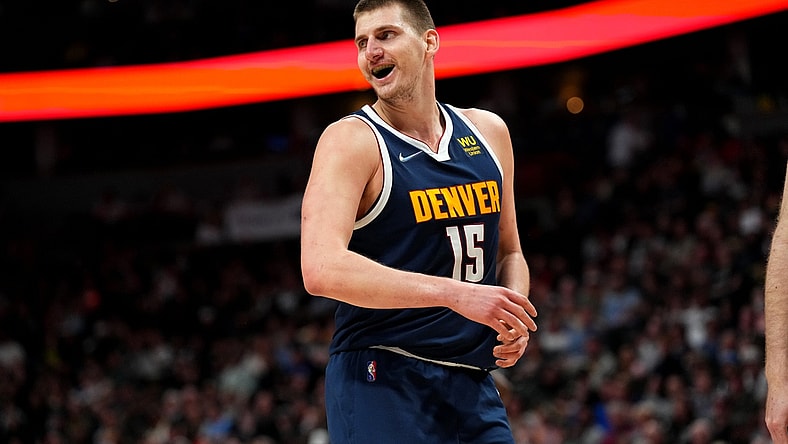 Apr 5, 2022; Denver, Colorado, USA; Denver Nuggets center Nikola Jokic (15) reacts in the second quarter against the San Antonio Spurs at Ball Arena. Mandatory Credit: Ron Chenoy-USA TODAY Sports