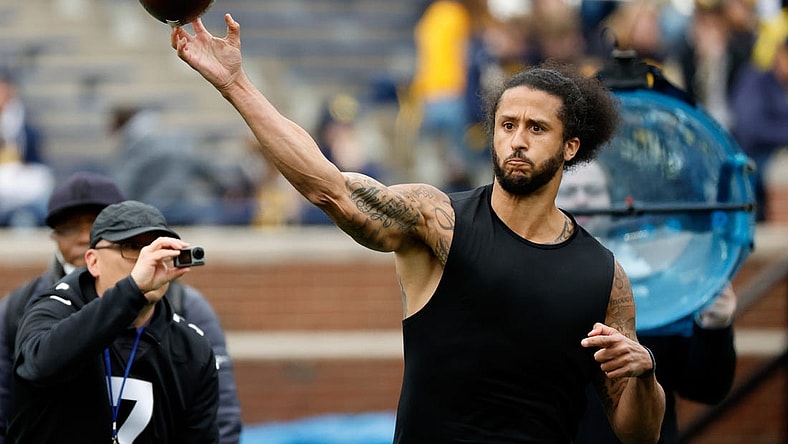 Apr 2, 2022; Ann Arbor, Michigan, USA;  Colin Kaepernick passes during halftime at the Michigan Spring game at Michigan Stadium. Mandatory Credit: Rick Osentoski-USA TODAY Sports