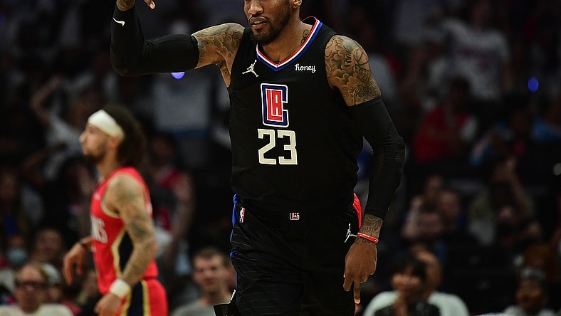 Apr 15, 2022; Los Angeles, California, USA; Los Angeles Clippers forward Robert Covington (23) reacts after scoring a three point basket against the New Orleans Pelicans during the first half of the play in game at Crypto.com Arena. Mandatory Credit: Gary A. Vasquez-USA TODAY Sports