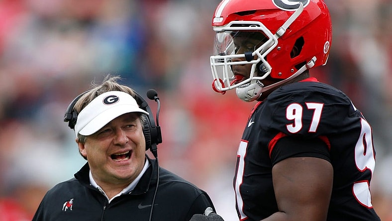 Georgia head coach Kirby Smart speaks with Georgia defensive lineman Warren Brinson (97) during the G-Day spring football game in Athens, Ga., on Saturday, April 16, 2022.

News Joshua L Jones