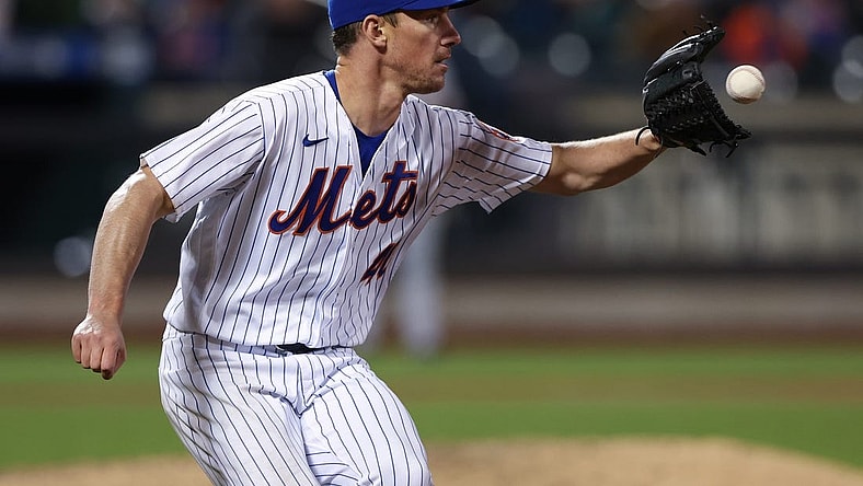 Apr 20, 2022; New York City, New York, USA; New York Mets starting pitcher Chris Bassitt (40) catches the ball for an out at first base during the fourth inning against the San Francisco Giants at Citi Field. Mandatory Credit: Vincent Carchietta-USA TODAY Sports