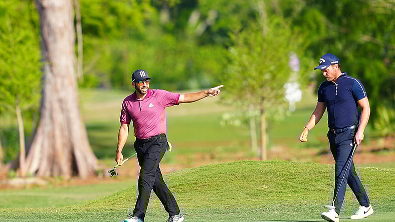 Apr 21, 2022; Avondale, Louisiana, USA; Sergio Garcia and Danny Willett walk on the 12th fairway during the first round of the Zurich Classic of New Orleans golf tournament. Mandatory Credit: Andrew Wevers-USA TODAY Sports